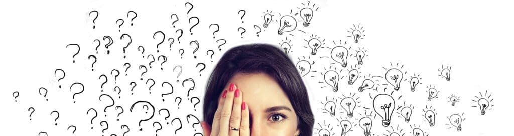 Young woman with many questions and answers idea light bulbs covering half of her face with hand